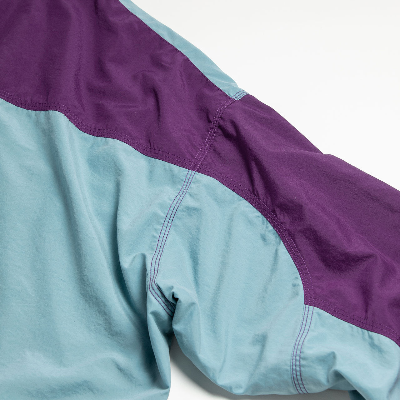 【ANACHRONORM】EXCHANGE PATTERN NYLON JACKET|AN387