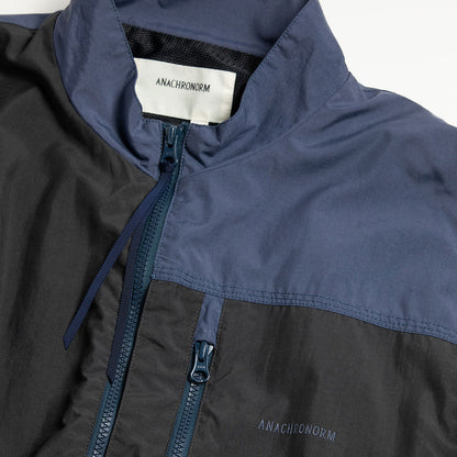 【ANACHRONORM】EXCHANGE PATTERN NYLON JACKET｜AN387